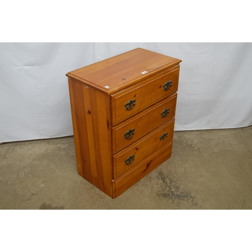 339 - Modern pine chest of three drawers, standing on a plinth base - 63cm x 34cm x 74cm tall (one handle ... 