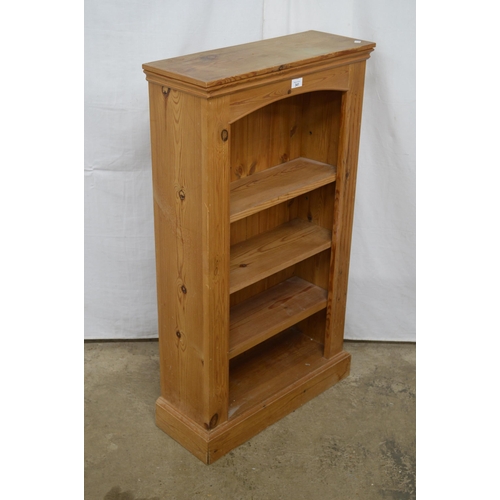 341 - Pine open bookshelves having three adjustable shelves, standing on plinth base - 60cm x 23cm x 107cm... 