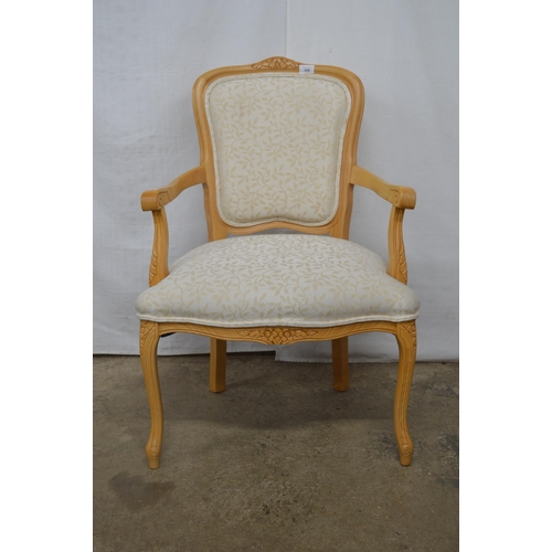 348 - Stuart Jones carved beech open armchair having padded back, seat and arm rests, standing on carved s... 