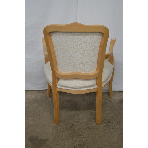 348 - Stuart Jones carved beech open armchair having padded back, seat and arm rests, standing on carved s... 