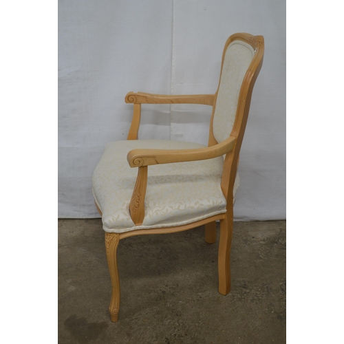 348 - Stuart Jones carved beech open armchair having padded back, seat and arm rests, standing on carved s... 