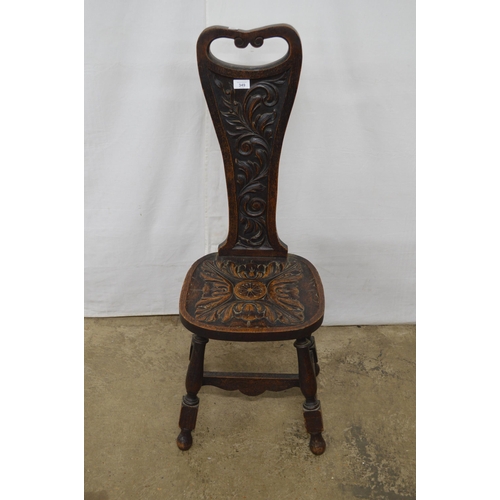 349 - Carved oak spinning chair having a pierced back with carved foliate decoration and carved seat, stan... 