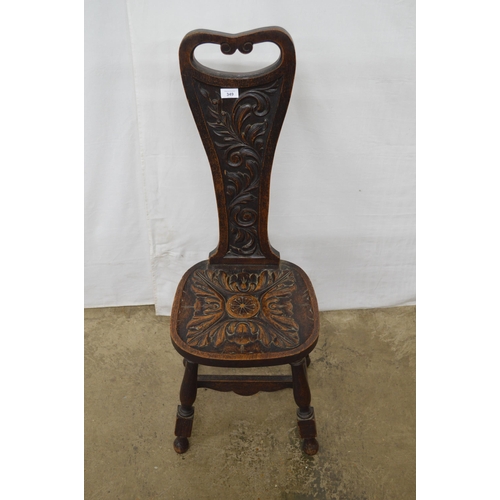 349 - Carved oak spinning chair having a pierced back with carved foliate decoration and carved seat, stan... 