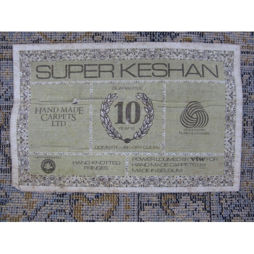 352 - Super Keshan blue ground patterned rug having a central lozenge with intricate floral and foliate de... 