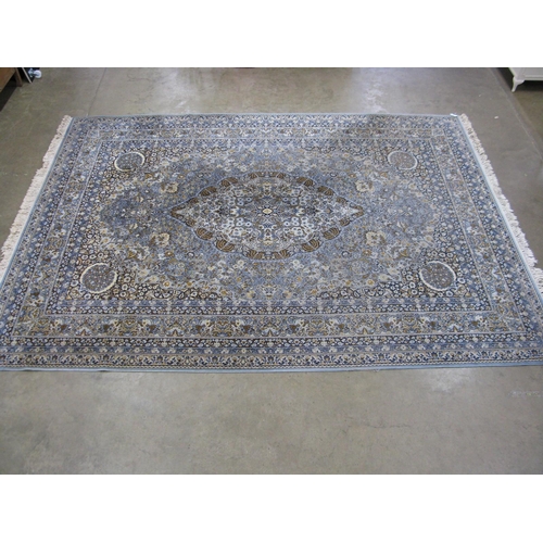 352 - Super Keshan blue ground patterned rug having a central lozenge with intricate floral and foliate de... 