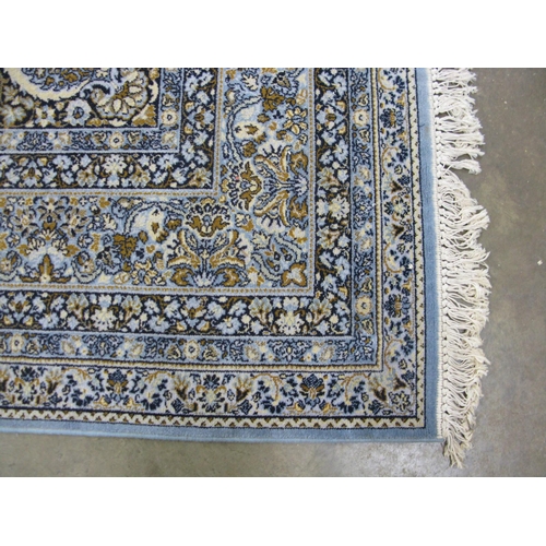 352 - Super Keshan blue ground patterned rug having a central lozenge with intricate floral and foliate de... 