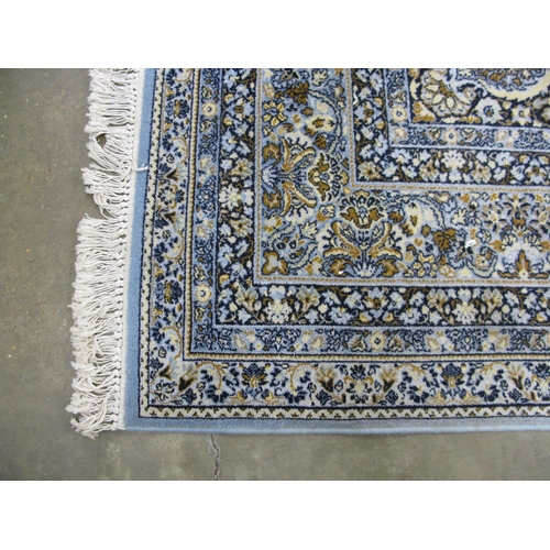 352 - Super Keshan blue ground patterned rug having a central lozenge with intricate floral and foliate de... 