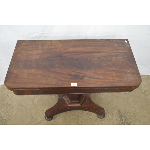 358 - Mahogany fold over card table the top opening to a circular green baize, standing on hexagonal colum... 