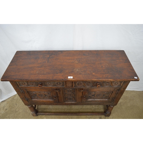 360 - Carved oak sideboard having two floral carved drawer fronts over two carved panelled door cupboard b... 