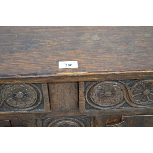 360 - Carved oak sideboard having two floral carved drawer fronts over two carved panelled door cupboard b... 