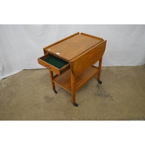 367 - Oak dropleaf tea trolley having a single drawer over a lower tier united by square supports on casto... 