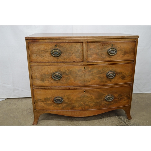 372 - Bow fronted mahogany chest of two short over two long drawers, standing on splayed front legs - 92cm... 