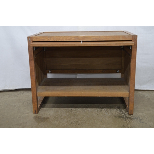 374 - Modern oak cupboard having a lift up and over door, standing on square legs - 90cm x 54cm x 70.5cm t... 