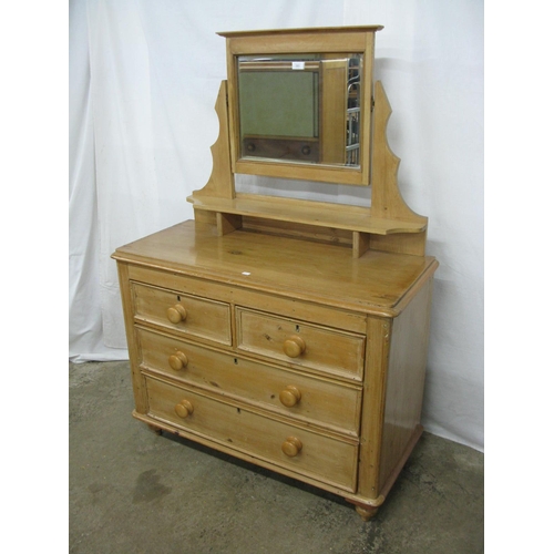 381 - Pine dressing chest, the bevelled edge mirror having shaped supports over a shelf with two short and... 