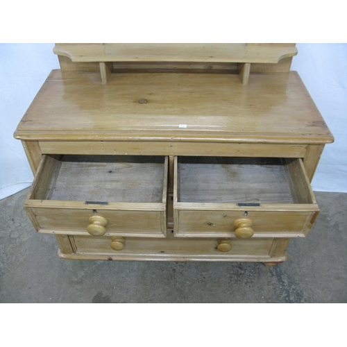 381 - Pine dressing chest, the bevelled edge mirror having shaped supports over a shelf with two short and... 