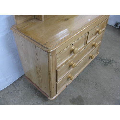 381 - Pine dressing chest, the bevelled edge mirror having shaped supports over a shelf with two short and... 