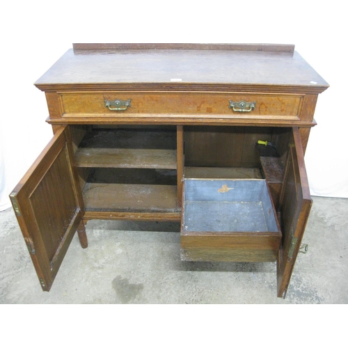 386 - Oak sideboard having raised back over a single long drawer with two panelled doors opening to a sing... 