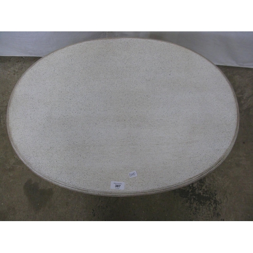 387 - Oval painted coffee table standing on fluted legs with X cross stretcher - 73cm x 52cm x 53cm tall