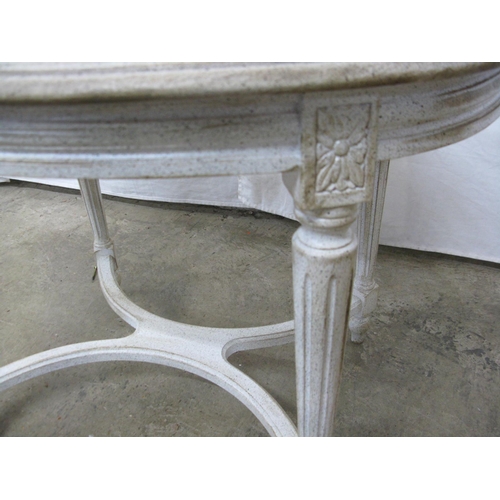 387 - Oval painted coffee table standing on fluted legs with X cross stretcher - 73cm x 52cm x 53cm tall