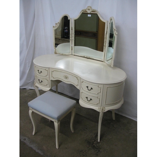 395 - Cream and gilt dressing table having a triple mirror over a kidney shaped top with an arrangement of... 