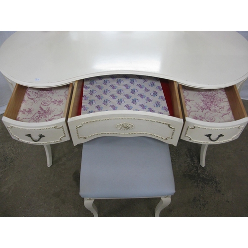 395 - Cream and gilt dressing table having a triple mirror over a kidney shaped top with an arrangement of... 