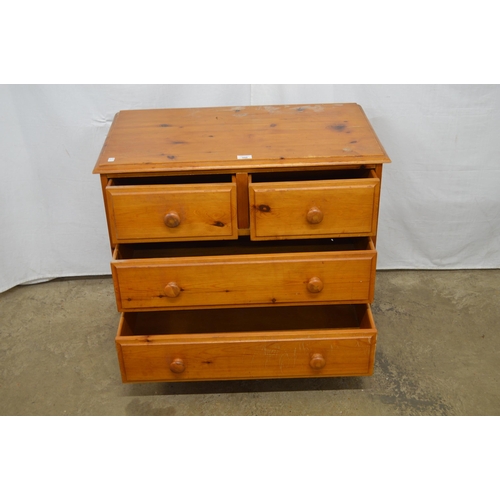 396 - Modern pine chest of two short over two long drawers, standing on turned legs - 79.5cm x 45cm x 72cm... 