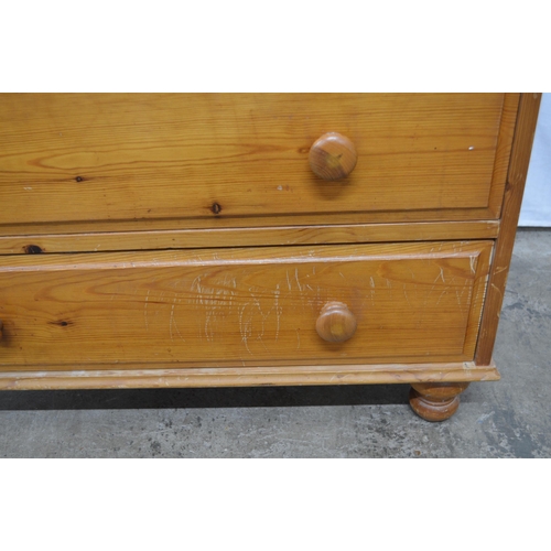 396 - Modern pine chest of two short over two long drawers, standing on turned legs - 79.5cm x 45cm x 72cm... 