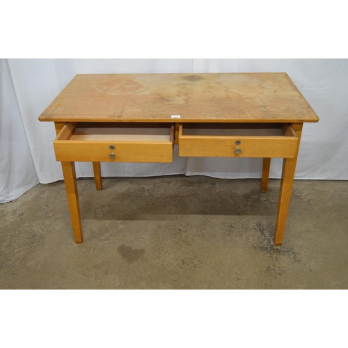 397 - Esavian two drawer desk, standing on square tapering legs - 122cm x 69cm x 76cm tall