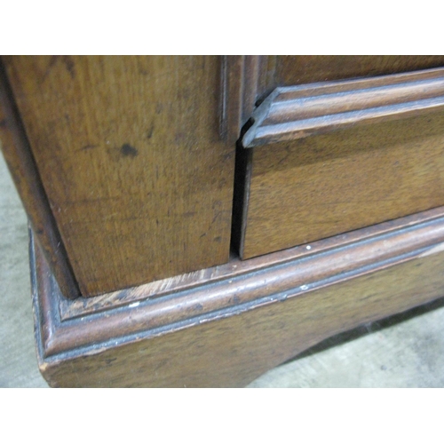 401 - Mahogany compactum wardrobe having two doors opening to four linen slides over two short drawers and... 