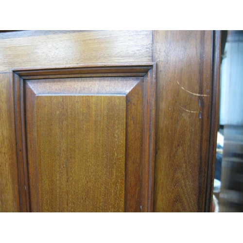 401 - Mahogany compactum wardrobe having two doors opening to four linen slides over two short drawers and... 