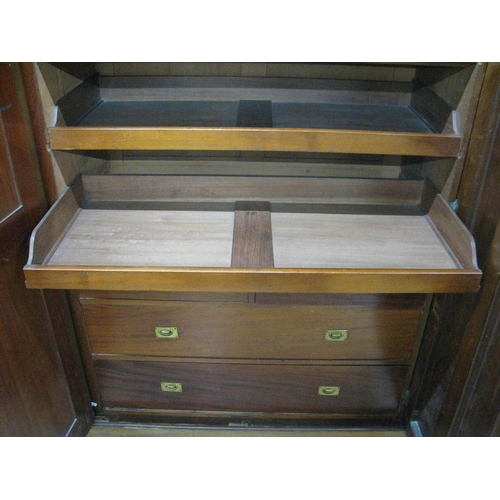 401 - Mahogany compactum wardrobe having two doors opening to four linen slides over two short drawers and... 