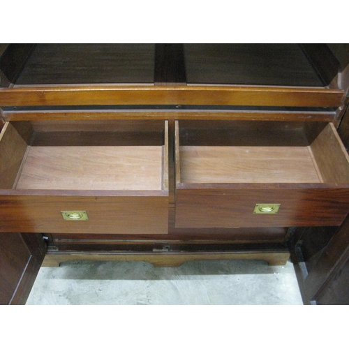 401 - Mahogany compactum wardrobe having two doors opening to four linen slides over two short drawers and... 