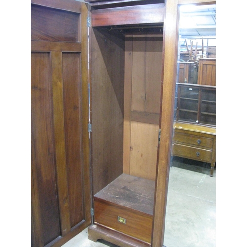 401 - Mahogany compactum wardrobe having two doors opening to four linen slides over two short drawers and... 