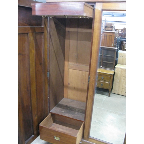 401 - Mahogany compactum wardrobe having two doors opening to four linen slides over two short drawers and... 