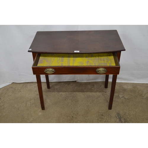 402 - Mahogany side table having a single drawer, standing on square supports - 78cm x 43cm x 71cm tall