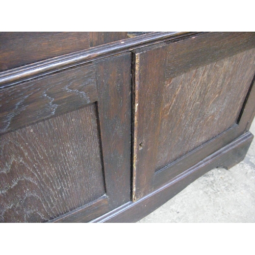 403 - Glazed oak bookcase, the arched pediment top over two frosted floral decorated glass doors, the door... 