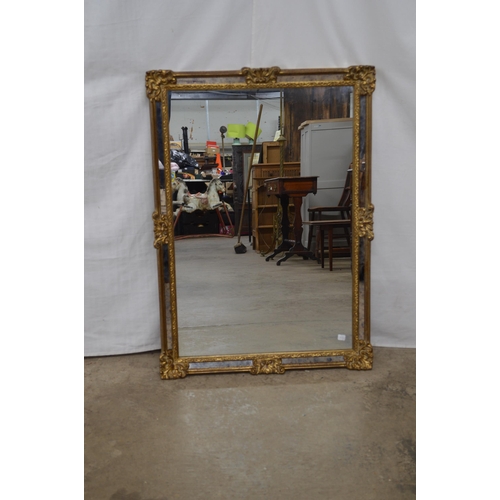 407 - Ornate rectangular gilt framed mirror - 67cm x 94cm tall