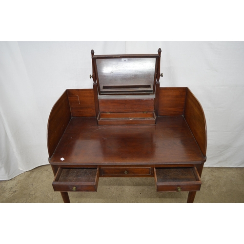 409 - Mahogany dressing table having a central mirror with trinket box below a raised gallery back, one fa... 