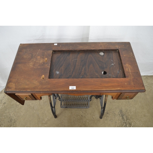 413 - Cast iron treadle sewing machine table having a wooden top with two drawers and drop flap - 88.5cm x... 