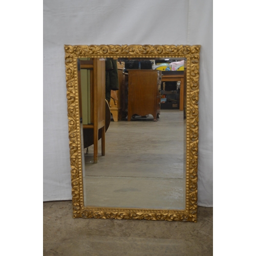 416 - Ornate rectangular gilt framed bevelled edge mirror - 52cm x 73cm together with a gilt framed mirror... 