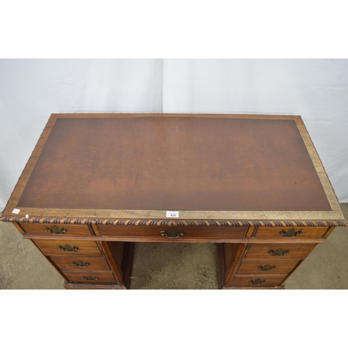 419 - Mahogany twin pedestal desk, the inset leatherette top with gadrooned edge over an arrangement of se... 