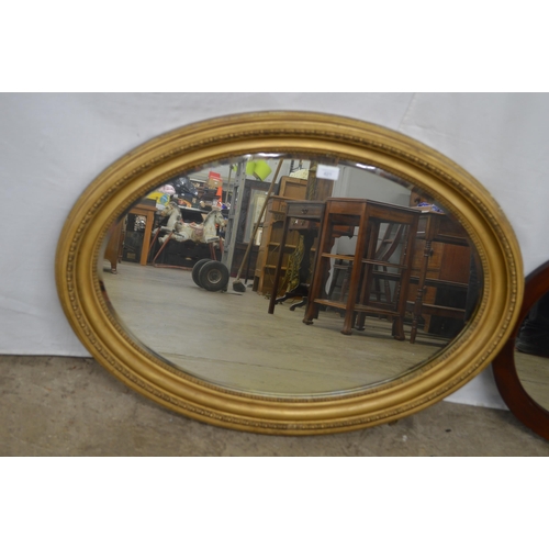 421 - Gilt framed oval bevelled edge mirror - 88cm x 65cm together with an oval mahogany framed mirror - 6... 