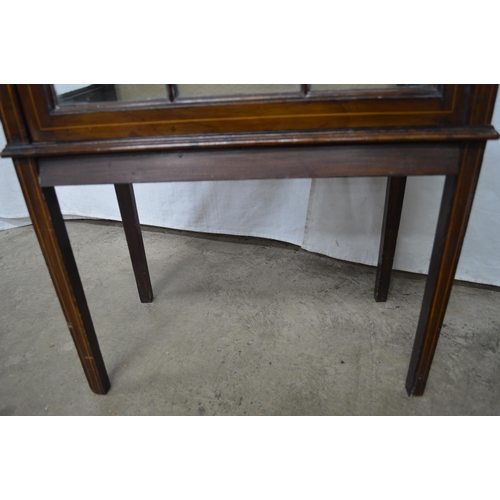 424 - Mahogany inlaid glazed display cabinet having a raised back over an astragal glazed door opening to ... 