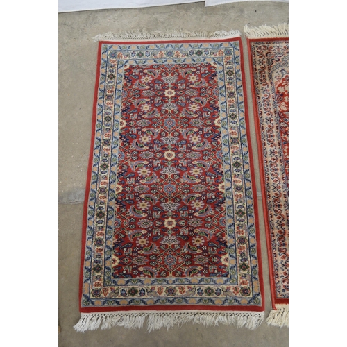 428 - Red and blue ground patterned rug having central repeating geometric pattern surrounded by patterned... 