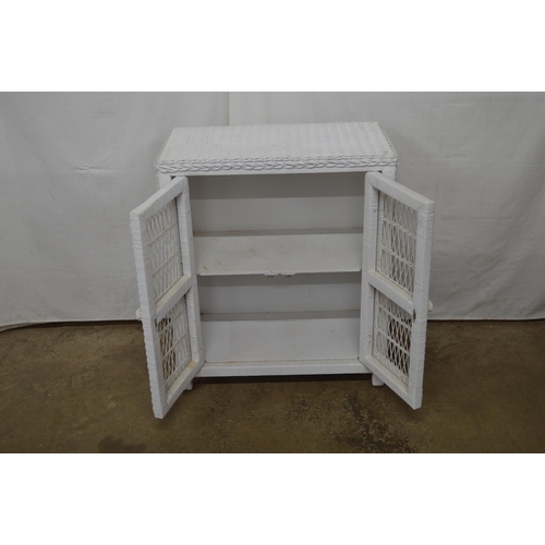 429 - Lloyd Loom style side cabinet, the two doors opening to a single shelf, standing on square legs - 70... 