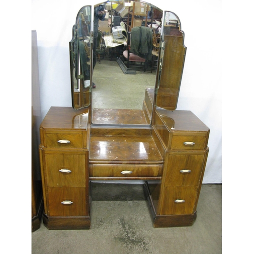 430 - 1930's walnut dressing table having a triple mirror over a central drawer flanked by three drawers, ... 