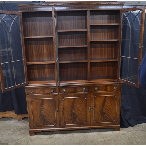 431 - Reproduction mahogany glazed bookcase, the top section having three astragal glazed doors opening to... 