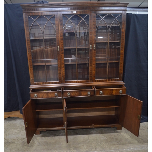 431 - Reproduction mahogany glazed bookcase, the top section having three astragal glazed doors opening to... 