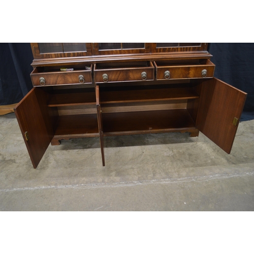 431 - Reproduction mahogany glazed bookcase, the top section having three astragal glazed doors opening to... 