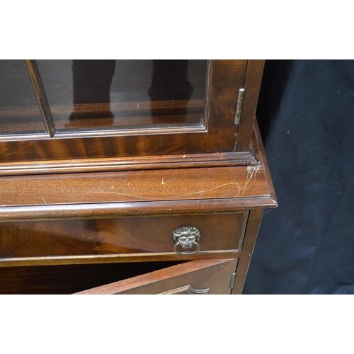 431 - Reproduction mahogany glazed bookcase, the top section having three astragal glazed doors opening to... 